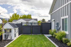 View of yard with a gate and a mountain view