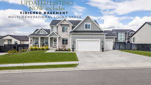 Craftsman house featuring board and batten siding, a porch, concrete driveway, a residential view, and stone siding