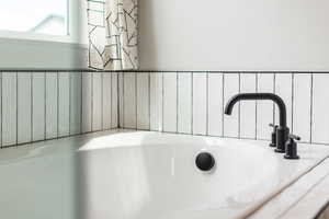 Bathroom view of a sink and a garden tub