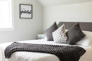 Bedroom with vaulted ceiling
