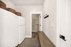 Mudroom with dark wood-style floors