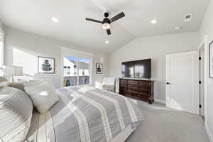 Bedroom featuring lofted ceiling, light carpet, access to outside, ceiling fan, and recessed lighting