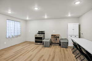 Misc room featuring light wood-type flooring and recessed lighting