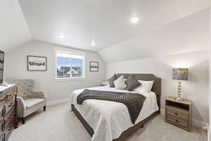 Bedroom with light carpet and recessed lighting