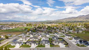 Aerial perspective of suburban area with a mountain backdrop