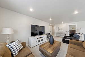 Living room featuring carpet flooring and recessed lighting