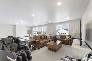 Living room featuring light carpet and recessed lighting