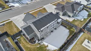 Snowy aerial view featuring a residential view
