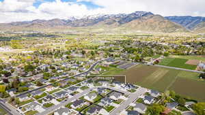 Aerial perspective of suburban area featuring a mountainous background