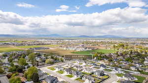 Aerial view of residential area featuring a mountain backdrop