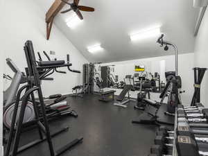 Workout area featuring ceiling fan and lofted ceiling
