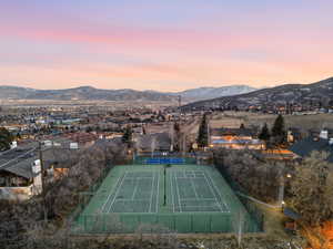 View of tennis court featuring a mountain view