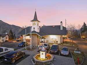 Property at dusk with uncovered parking