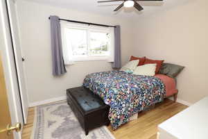 Bedroom featuring light wood-style floors and ceiling fan