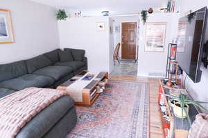 Living room with light wood-type flooring