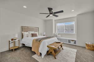 Carpeted bedroom featuring recessed lighting and ceiling fan