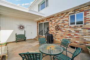 View of patio / terrace with outdoor dining area and a grill