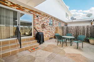 View of patio / terrace featuring outdoor dining space and grilling area