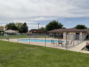 Community pool with a patio area