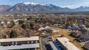 Aerial perspective of suburban area with a mountain backdrop