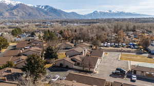 Aerial perspective of suburban area featuring a mountainous background