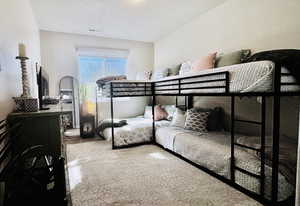 Bedroom 1 with bunk beds and valenced window.