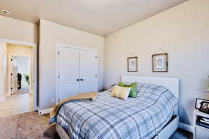 Bedroom 2 with french closet doors.