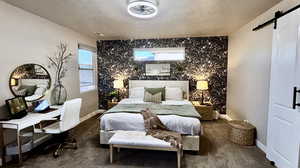 Primary suite with king bed, wallpaper, and valenced windows.