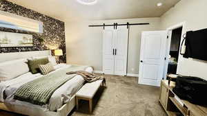 Owner's suite with a french barn doors, and king bed.