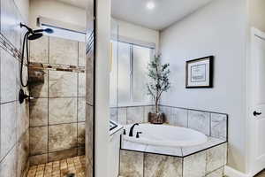Primary bath with soaker tub and  walk-in shower.