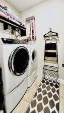 Laundry room with ample storage.