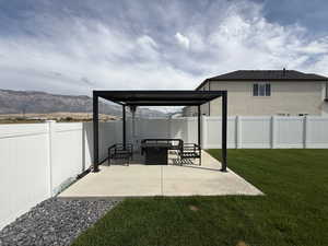 Professionally landscaped yard and fully fenced with 14 x 14 pergola pad with extended patio extension 13 x13.