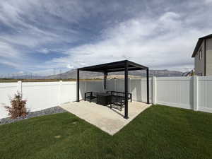 Professionally landscaped yard and fully fenced with 14 x 14 pergola pad with extended patio extension 13 x13.