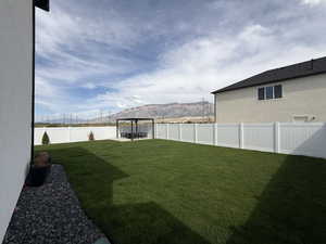Professionally landscaped yard and fully fenced with 14 x 14 pergola pad with extended patio extension 13 x13.