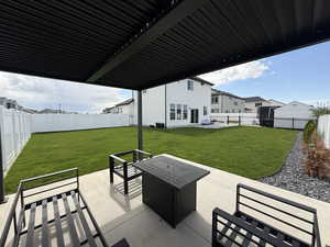 Professionally landscaped yard and fully fenced with 14 x 14 pergola pad with extended patio extension 13 x13.