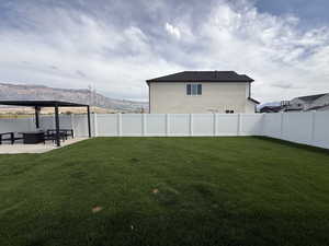 Professionally landscaped yard and fully fenced with 14 x 14 pergola pad with extended patio extension 13 x13.