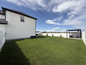 Professionally landscaped yard and fully fenced with 14 x 14 pergola pad with extended patio extension 13 x13.