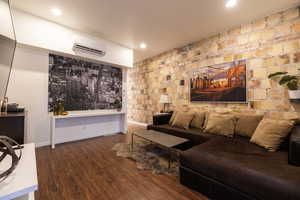 Apt. #1 Family room with original stone accent wall