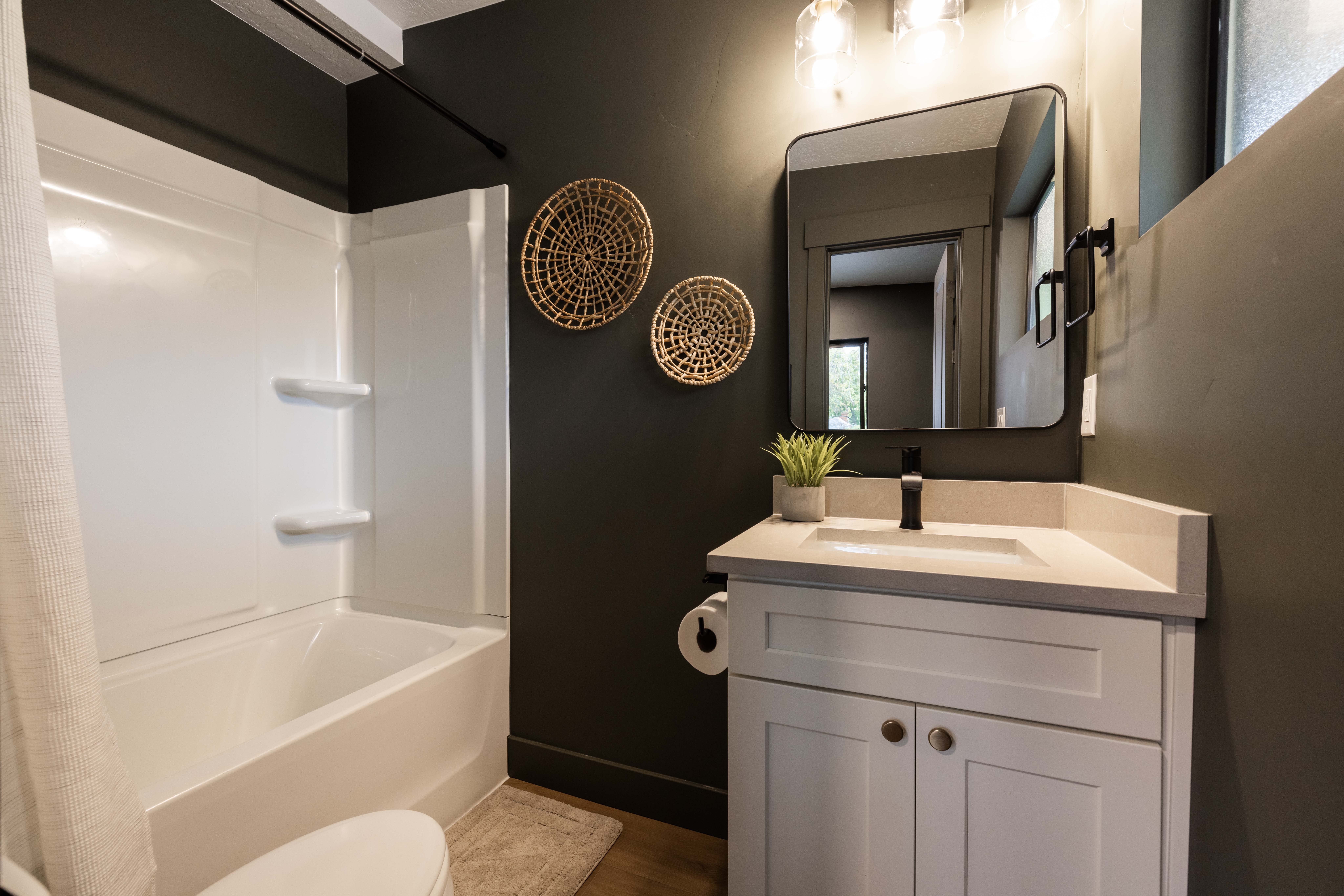 Apt. #4 Full bathroom with vanity and shower / bath combo