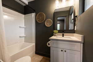 Apt. #4 Full bathroom with vanity and shower / bath combo