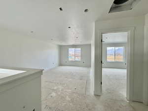 Unfurnished room with a textured ceiling