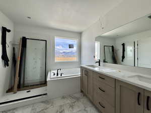 Full bathroom with a stall shower, a bath, double vanity, light marble finish flooring, and a textured ceiling