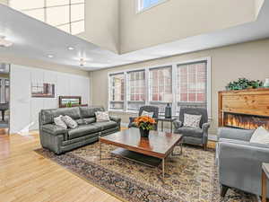 Great room featuring a high ceiling and bamboo floors