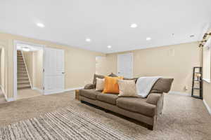 Living room featuring recessed lighting and carpet floors