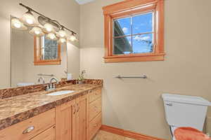 Bathroom with toilet and vanity