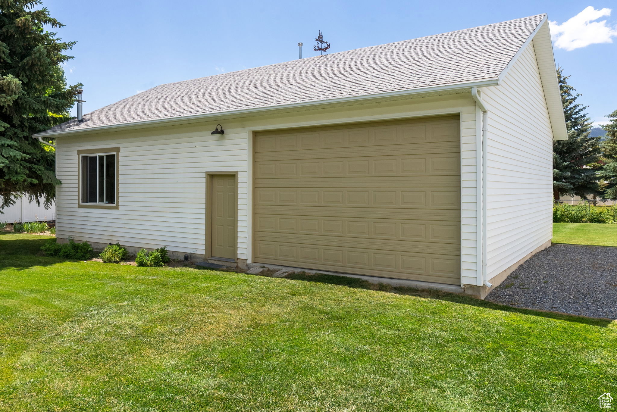 View of garage and outbuilding