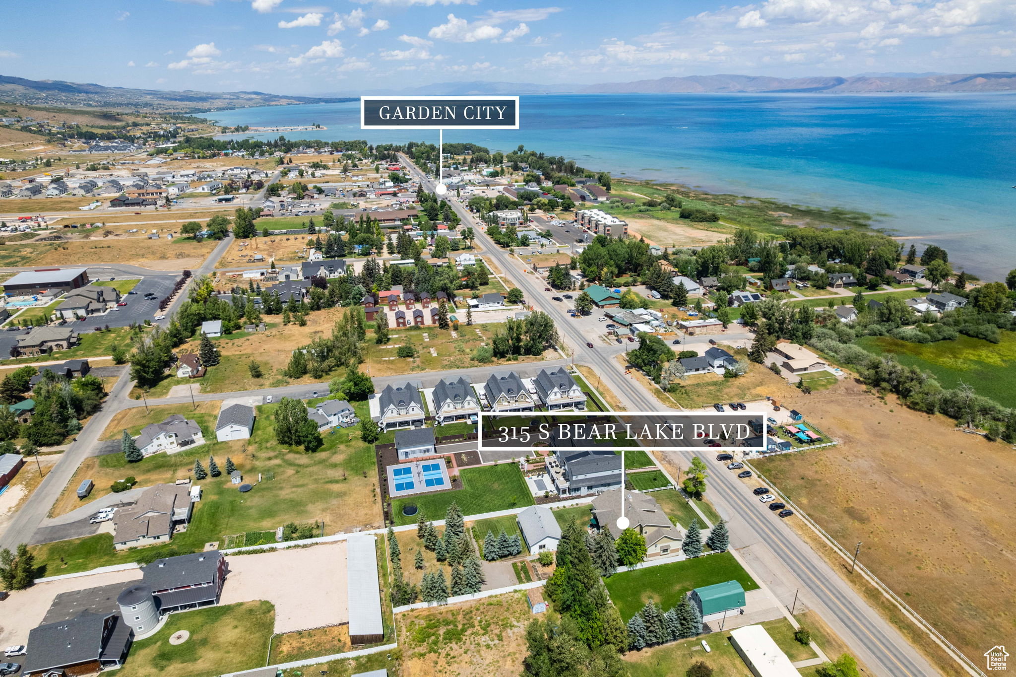 Aerial overview of property's location featuring nearby suburban area and property parcel outlined