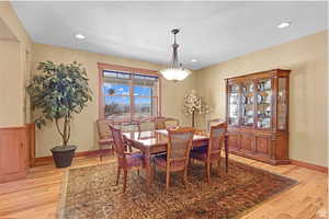 Dining room featuring light wood-style flooring and recessed lighting