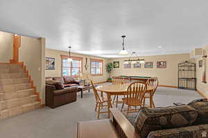 Dining room with carpet, stairs, and billiards