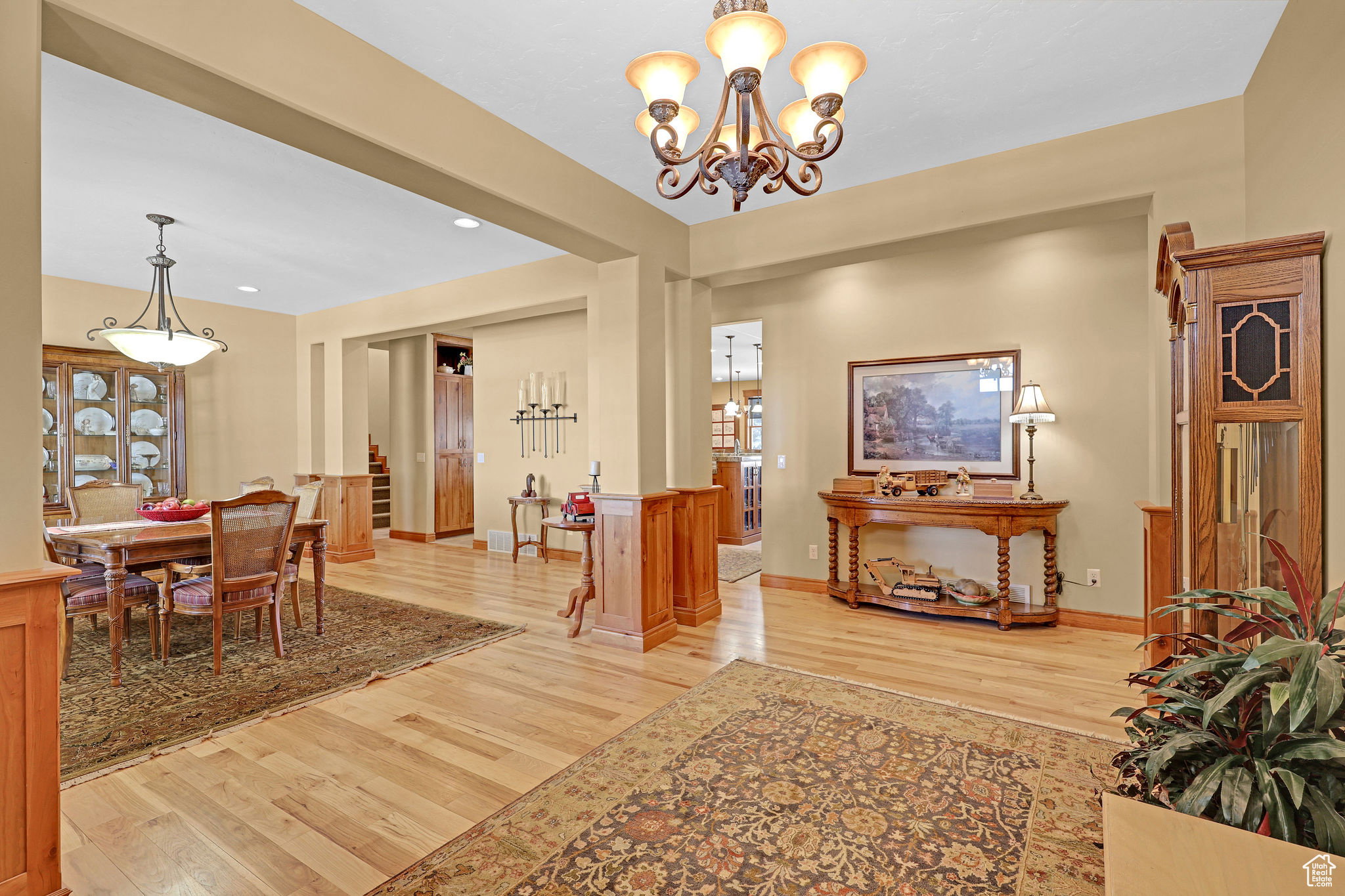 Dining space featuring light wood-style flooring, a chandelier, and recessed lighting
